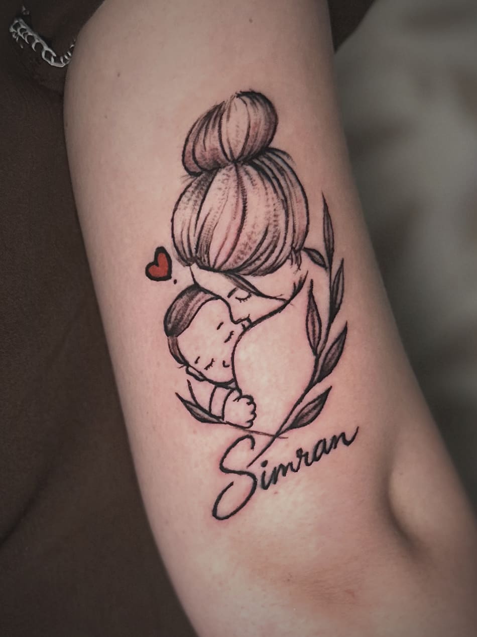 Fine-line piece on an elbow: a figure with a hair bun holding a rabbit, one red heart, a laurel and script beneath